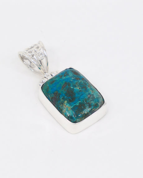 Natural Chrysocolla sterling silver pendant with vivid turquoise blue and green mineral patterns, rectangular Chrysocolla gemstone and ornate silver bail.