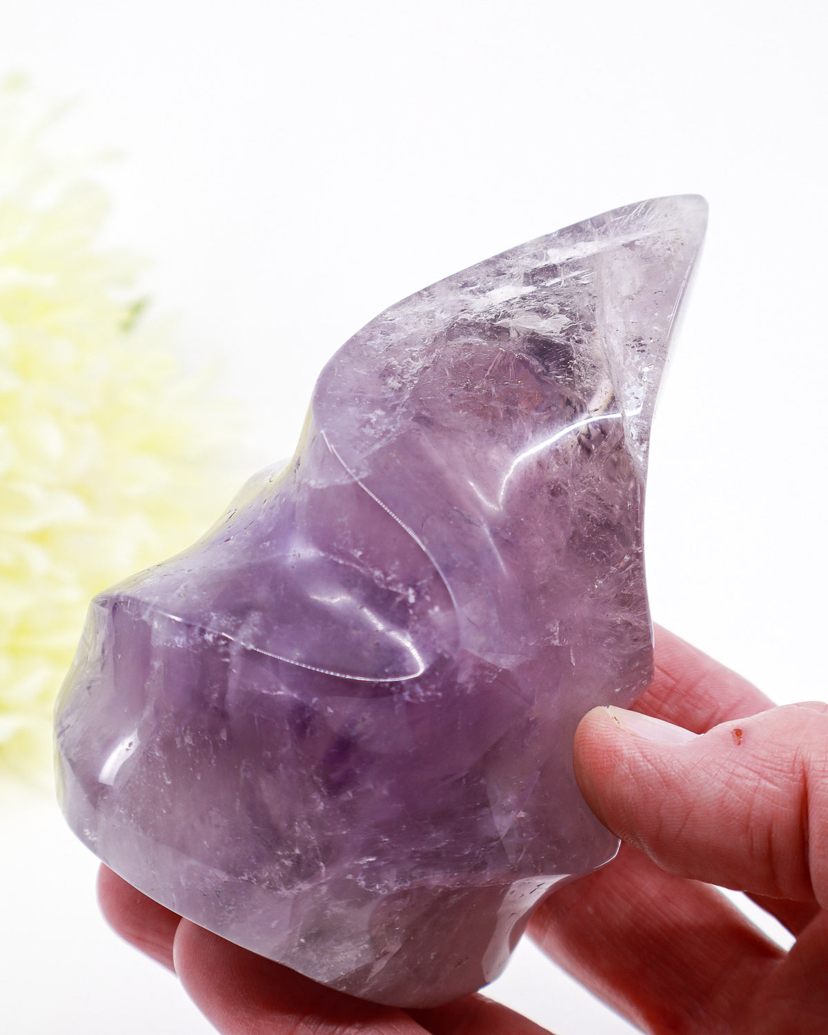 Natural Amethyst Flame 515g with translucent pale lavender and violet colouring, clear crystal areas and beautiful internal formations, polished purple crystal flame.