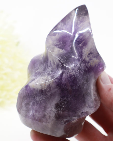 Natural Amethyst Flame 542g measuring 11.5cm with deep violet purple colour, lavender tones and beautiful white internal crystal formations, polished Amethyst carving.