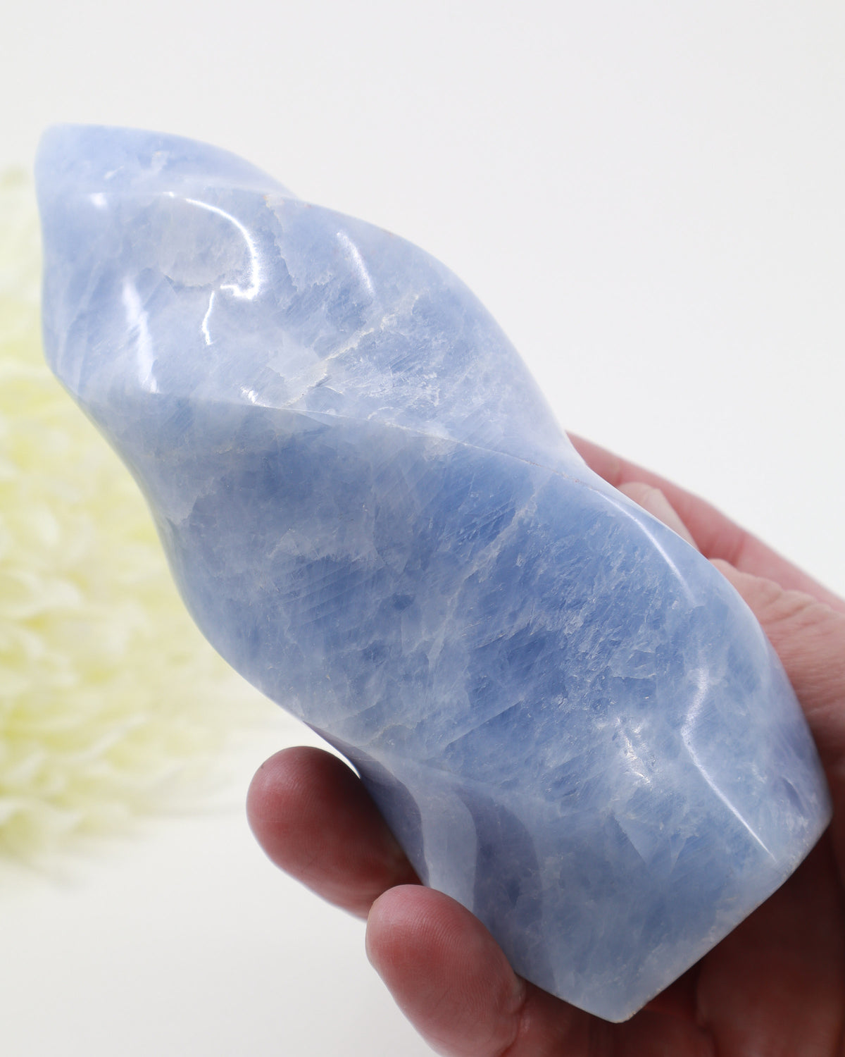 Large Blue Calcite Flame 684g approximately 14cm tall with soft powder blue and white crystalline patterns, polished natural Blue Calcite crystal carving.