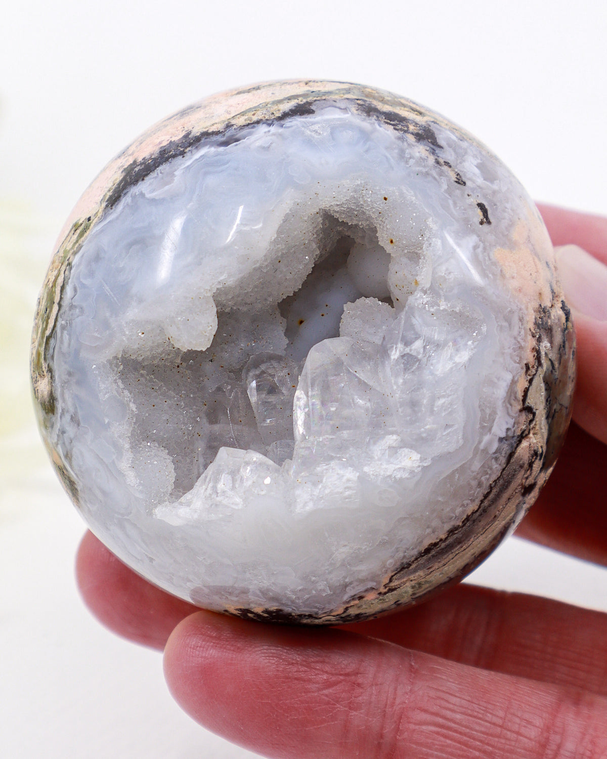 Natural Druzy Agate Geode Sphere 295g with two crystal-filled cavities, lavender-grey agate banding, earthy pink and brown mineral matrix and decorative gold display stand.