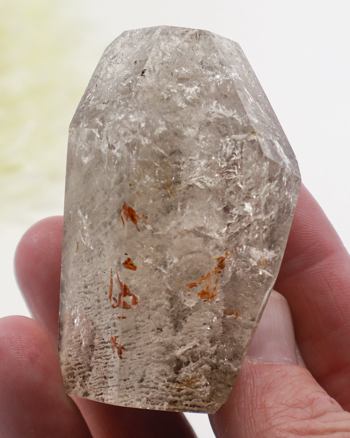 Garden Quartz Lodolite crystal 125g featuring white scenic mineral formations, rusty-orange inclusions and polished angled termination.