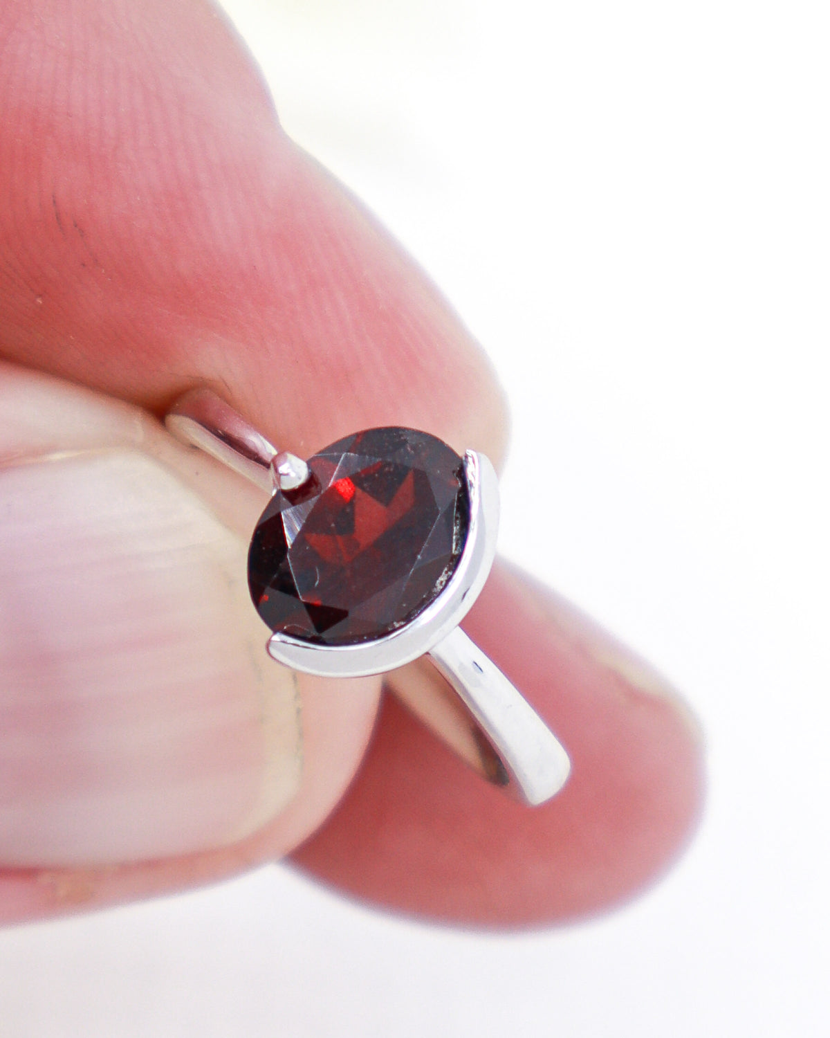 Natural Garnet sterling silver ring Size 7 with faceted oval deep red Garnet gemstone in a modern .925 silver setting.