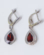 Natural Garnet sterling silver drop earrings with faceted pear shaped deep red Garnet gemstones in polished .925 silver settings.