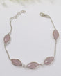 Sterling silver Rose Quartz gemstone bracelet with soft pink marquise-shaped stones displayed beside ruler for size reference.