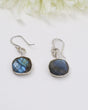 Natural Labradorite sterling silver earrings with vivid blue flash labradorescence photographed on a soft cream background by Inspired By 3 Australia.