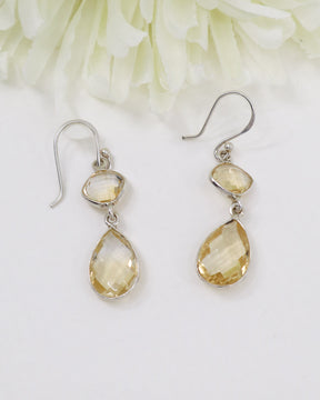 Natural faceted Citrine sterling silver drop earrings with warm golden gemstones photographed on a soft cream background by Inspired By 3 Australia.