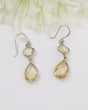 Natural faceted Citrine sterling silver drop earrings with warm golden gemstones photographed on a soft cream background by Inspired By 3 Australia.