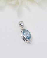 Blue Topaz .925 sterling silver marquise pendant with faceted pale blue gemstone and polished silver setting.