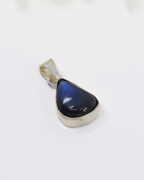 Sterling silver Labradorite pendant featuring vivid blue flash in polished teardrop gemstone setting.
