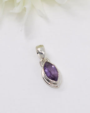 Faceted marquise Amethyst sterling silver pendant with deep violet gemstone in elegant polished silver setting.