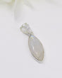 Marquise-shaped Rainbow Moonstone sterling silver pendant with soft blue flash and polished gemstone on a white background.