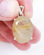 Brazilian Golden Rutilated Quartz pendant in .925 sterling silver with natural golden Rutile needles, oval faceted crystal jewellery Australia.
