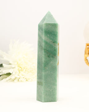 Polished Green Aventurine crystal tower with soft green tones and natural shimmer.