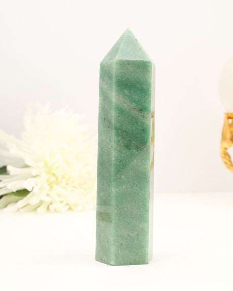 Polished Green Aventurine crystal tower with soft green tones and natural shimmer.