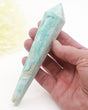 Natural blue Hemimorphite crystal wand 140g with aqua blue, white and cream banding, natural cavities and gold display stand.