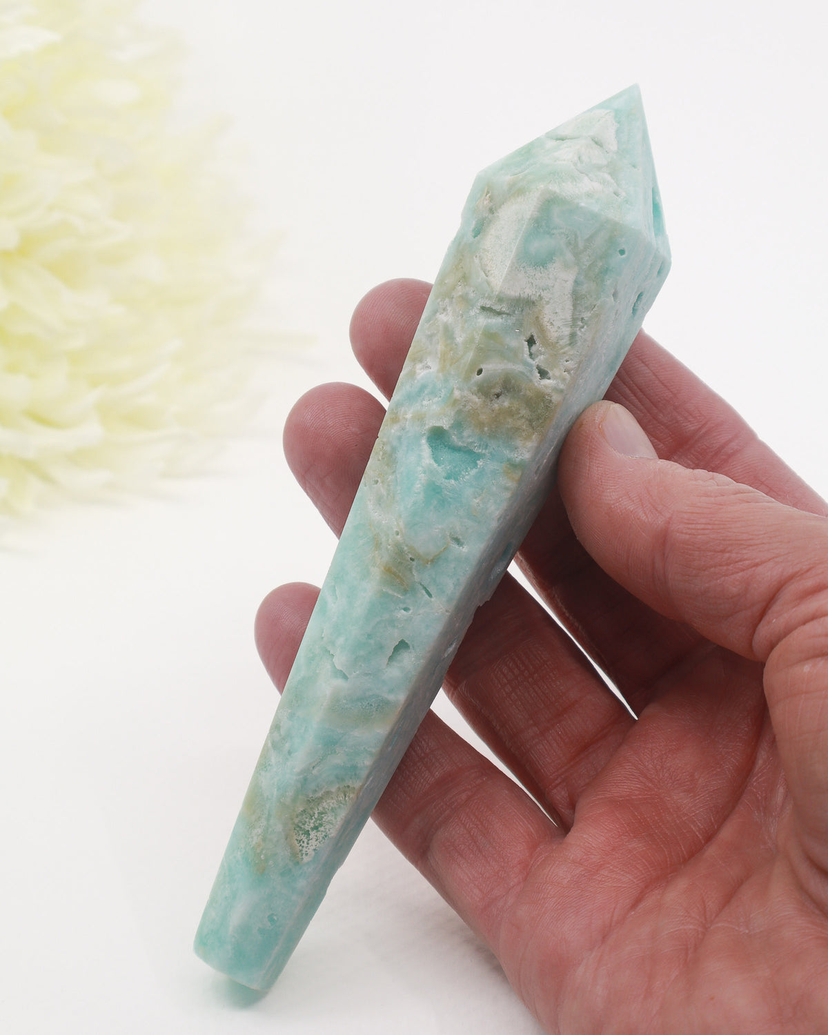 Natural blue Hemimorphite crystal wand 138g with aqua blue and white colouring, natural crystal cavities and gold display stand.