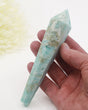Natural blue Hemimorphite crystal wand 138g with aqua blue and white colouring, natural crystal cavities and gold display stand.