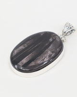 Natural Hypersthene sterling silver pendant with dark charcoal stone, silvery bronze flash, oval gemstone and ornate .925 silver bail.