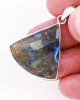 Natural faceted Labradorite sterling silver pendant with blue, green, aqua and gold flash, geometric fan-shaped Labradorite crystal jewellery.