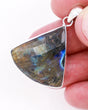 Natural faceted Labradorite sterling silver pendant with blue, green, aqua and gold flash, geometric fan-shaped Labradorite crystal jewellery.