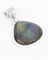 Natural Labradorite sterling silver pendant with gold, green, blue and violet flash, rounded triangular gemstone and ornate .925 silver scrollwork bail.