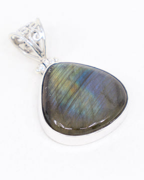 Natural Labradorite sterling silver pendant with gold, green, blue and violet flash, rounded triangular gemstone and ornate .925 silver scrollwork bail.