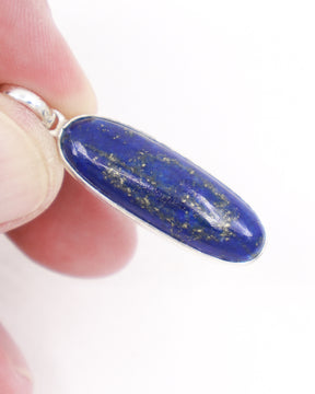 Natural Lapis Lazuli sterling silver pendant with deep royal blue stone and golden pyrite, elongated oval Lapis crystal necklace Australia.
