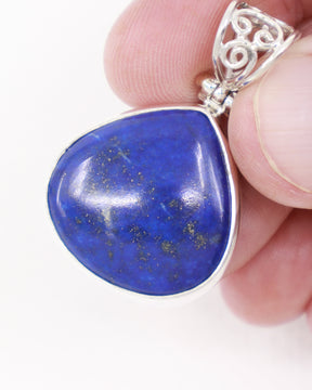 Natural Lapis Lazuli sterling silver pendant with deep royal blue gemstone, golden pyrite and ornate scrollwork bail, crystal jewellery Australia.