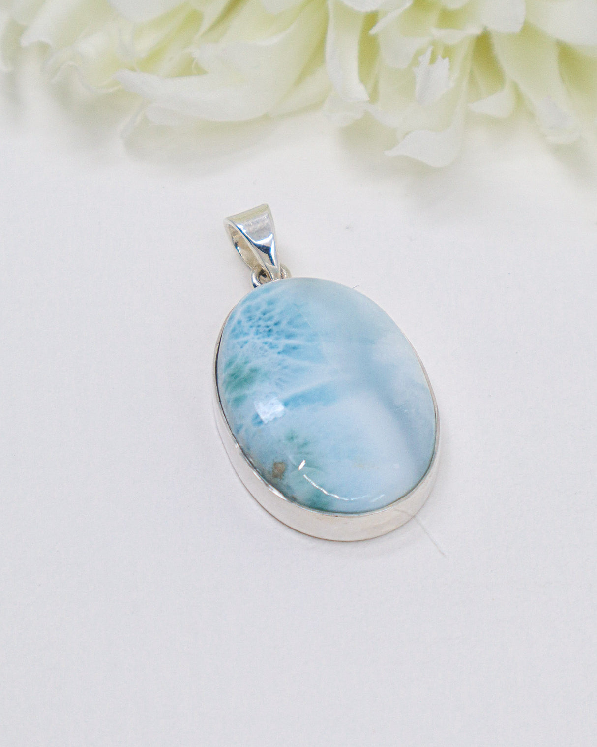Large genuine Larimar silver pendant with ocean-blue natural patterns set in polished sterling silver.