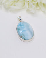 Large genuine Larimar silver pendant with ocean-blue natural patterns set in polished sterling silver.