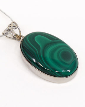 Natural Malachite sterling silver pendant with vivid emerald green concentric banding and ornate .925 silver bail – The Alchemist’s Portal.