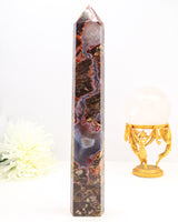 Large polished Money Agate crystal tower featuring rich red veining, earthy natural patterns and sparkling druzy agate sections.