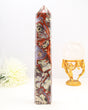 Large polished Money Agate crystal tower with red, cream and earthy natural patterns displayed beside a ruler.