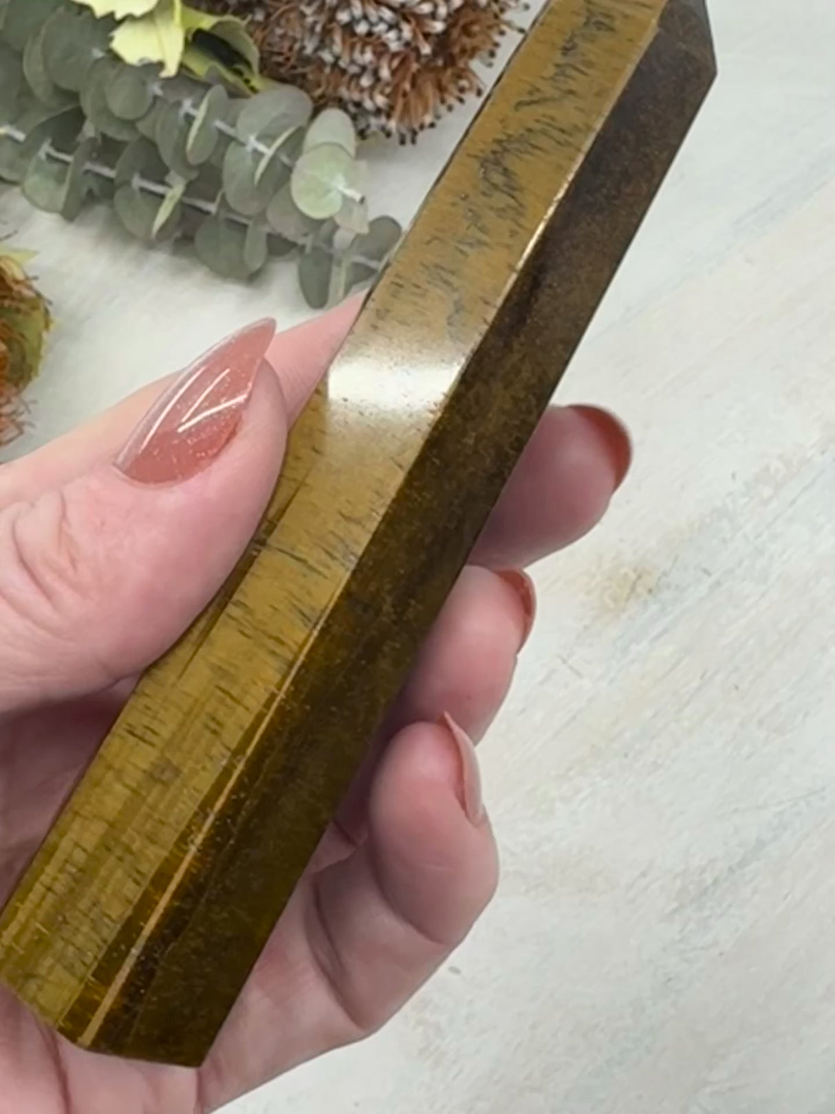 video of 6-Sided Tiger Eye Point 12 cm × 3 cm – golden-brown crystal point symbolising courage, grounding and strength, Inspired By 3 Australia.