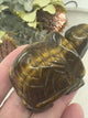 vide of Tiger Eye Turtle Carving 5 cm × 3.5 cm – golden-brown crystal turtle symbolising courage, strength and grounding, Inspired By 3 Australia.