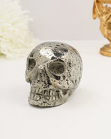 Large Peruvian Pyrite crystal skull carving with sparkling druzy inclusions and metallic silver-gold polish weighing 1.256kg.