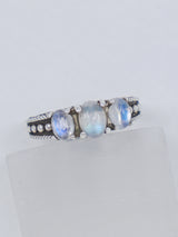 Natural Rainbow Moonstone sterling silver ring size 8 with three pearly white gemstones displaying blue flash in an ornate .925 silver setting.