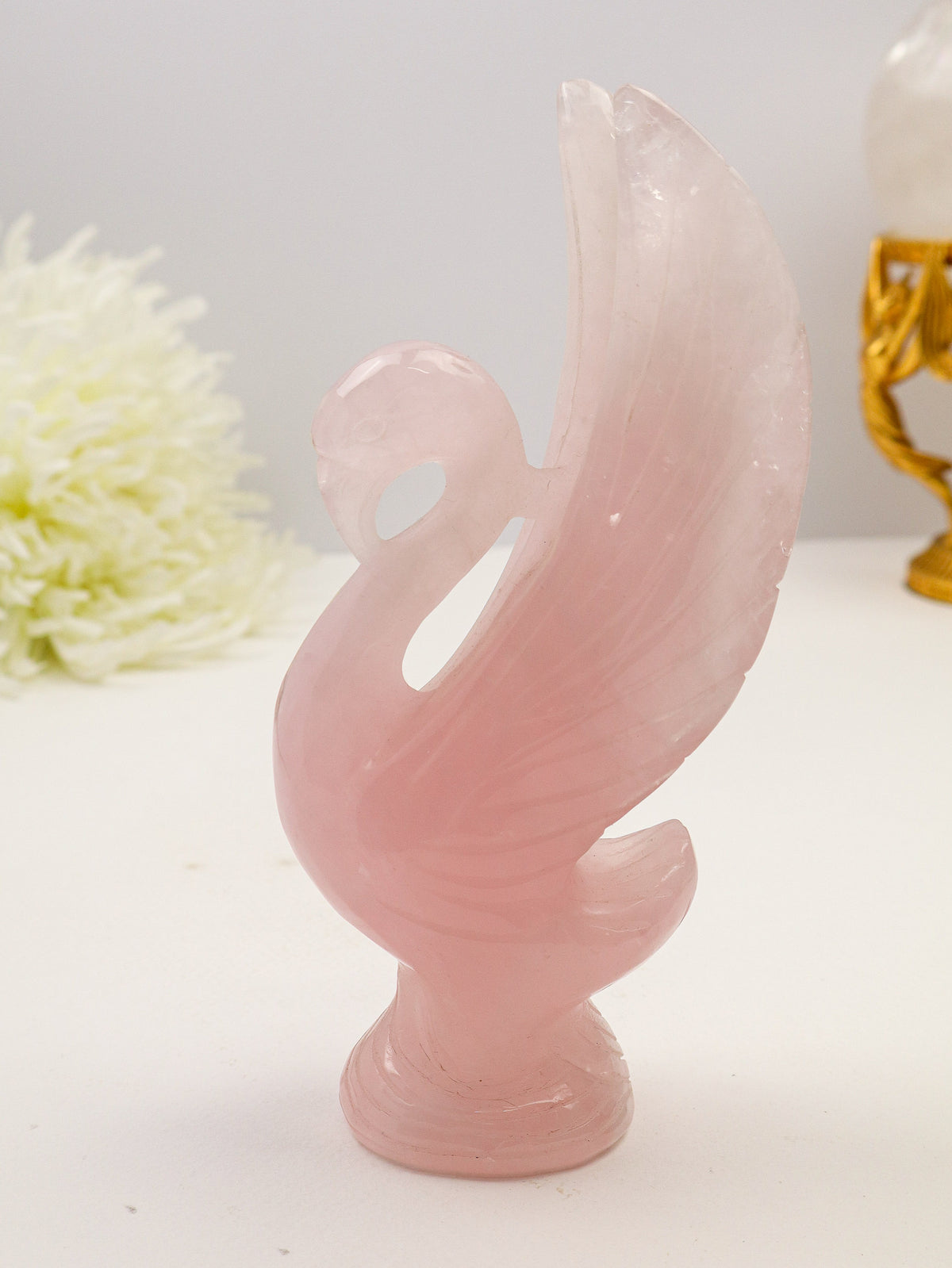 Large hand-carved Rose Quartz Swan 568g measuring 18cm with blush pink natural crystal, detailed raised wings and feather carving.