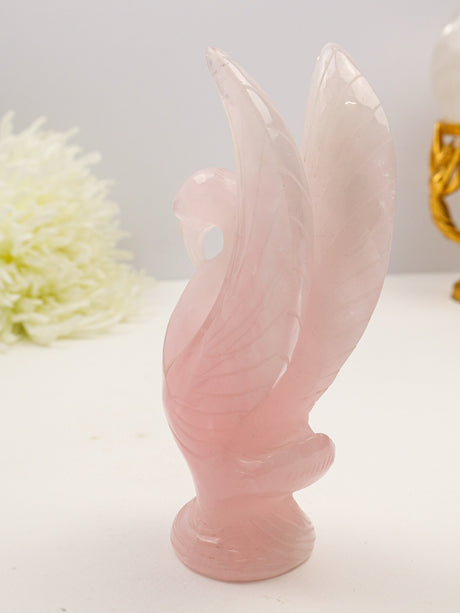 Large hand-carved Rose Quartz Swan 568g measuring 18cm with blush pink natural crystal, detailed raised wings and feather carving.