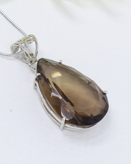 Brazilian Smoky Quartz teardrop pendant in .925 sterling silver with faceted natural brown crystal for grounding and protection.