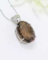 Brazilian Smoky Quartz oval pendant in .925 sterling silver with faceted brown crystal for grounding, protection and energetic cleansing.