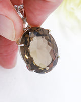  Brazilian Smoky Quartz oval pendant in .925 sterling silver with faceted brown crystal for grounding, protection and energetic cleansing.