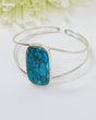 Sterling Silver Turquoise bangle 15.60g featuring a vibrant blue rectangular gemstone with beautiful webbed matrix in an open statement bangle design.