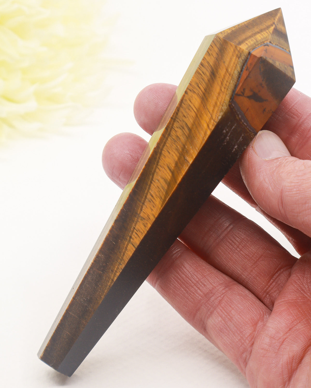 Natural Tiger Eye crystal wand 120g with golden brown chatoyant bands, polished faceted point and gold display stand, 13.2cm.