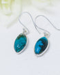Natural Turquoise sterling silver drop earrings with blue marquise gemstones and earthy matrix in .925 silver settings.