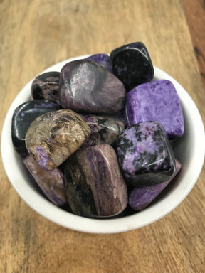 Charoite tumbled stone in swirling purple and lilac tones — crystal of transformation, insight, and divine connection.

Would you like me to do Chrysocolla or Citrine next?