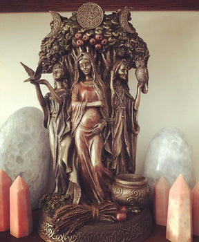 "Triple Goddess bronze statue with Maiden, Mother and Crone figures – symbol of divine feminine energy and lunar cycles"