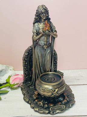 "Brigid bronze statue – Celtic Goddess of Fire, Healing, Poetry and Hearth, holding flame symbol of inspiration and renewal"